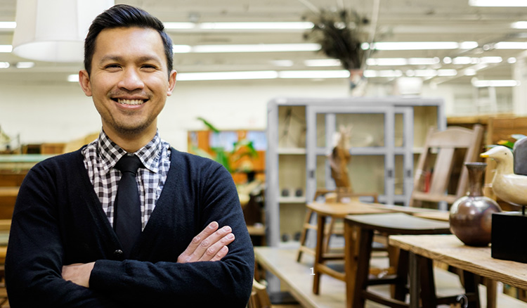 Smiling Business Owner Standing in Furniture Store.jpg